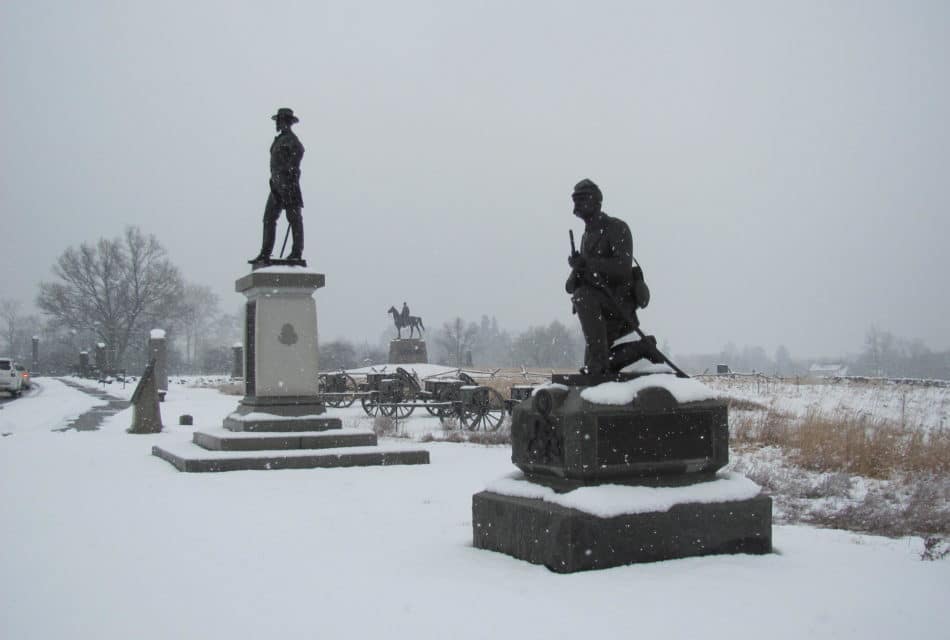 row of monuments covered in snow
