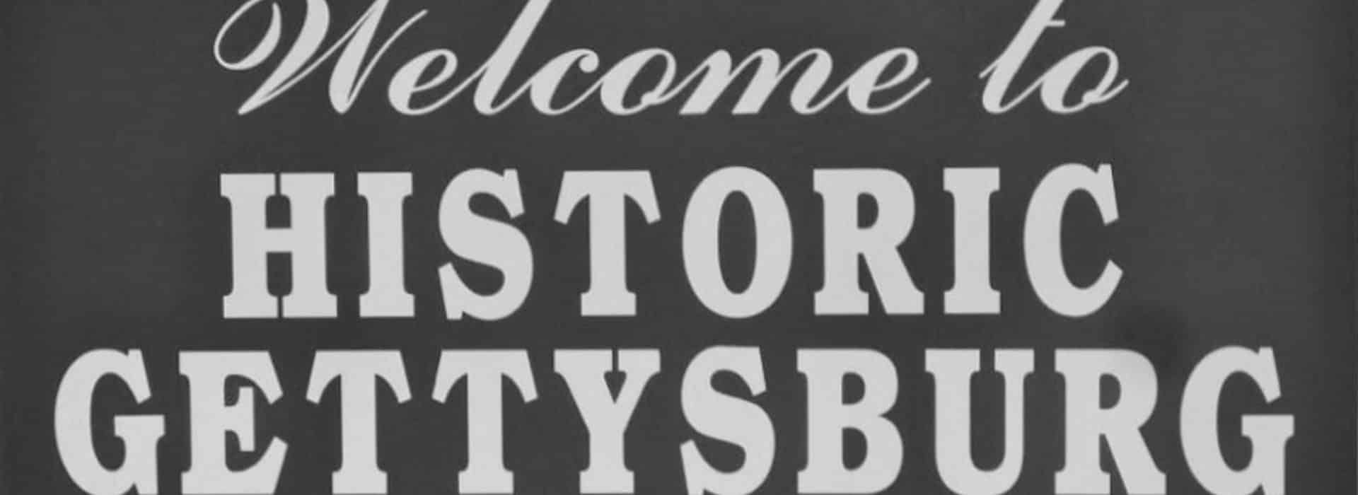 Black and white sign with text Welcome to Historic Gettysburg